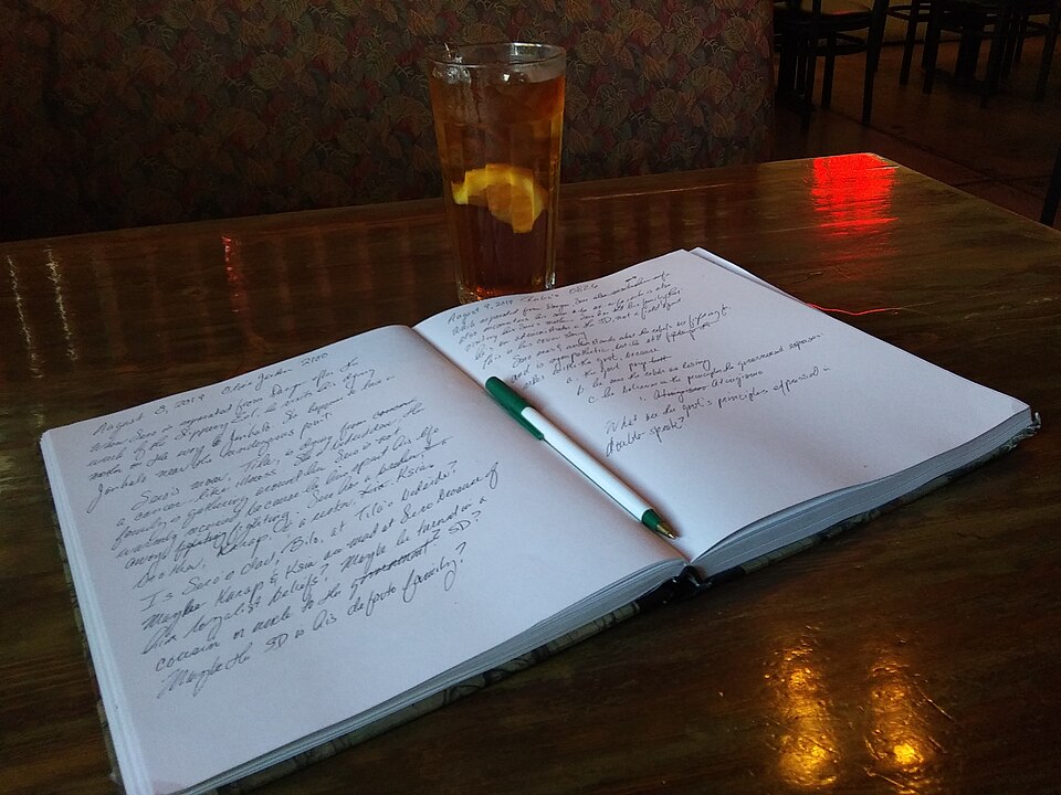 Notebook and pen ready for taking notes.