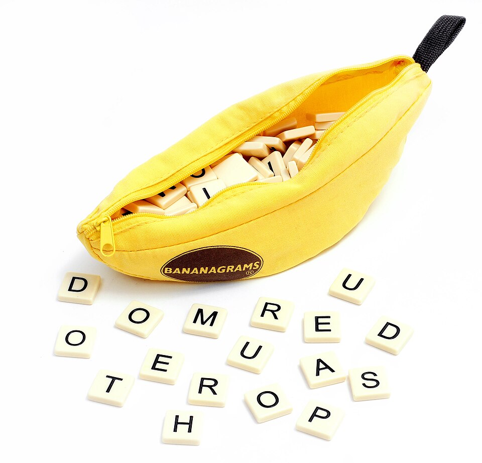 Bananagrams letter tiles and their banana-shaped pouch